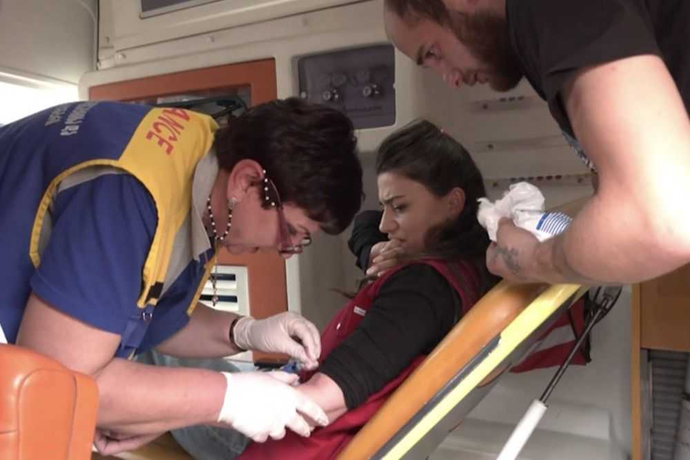 TV Pirveli journalist Mariam Makasarasvhili being treated in an ambulance. Screengrab from video.