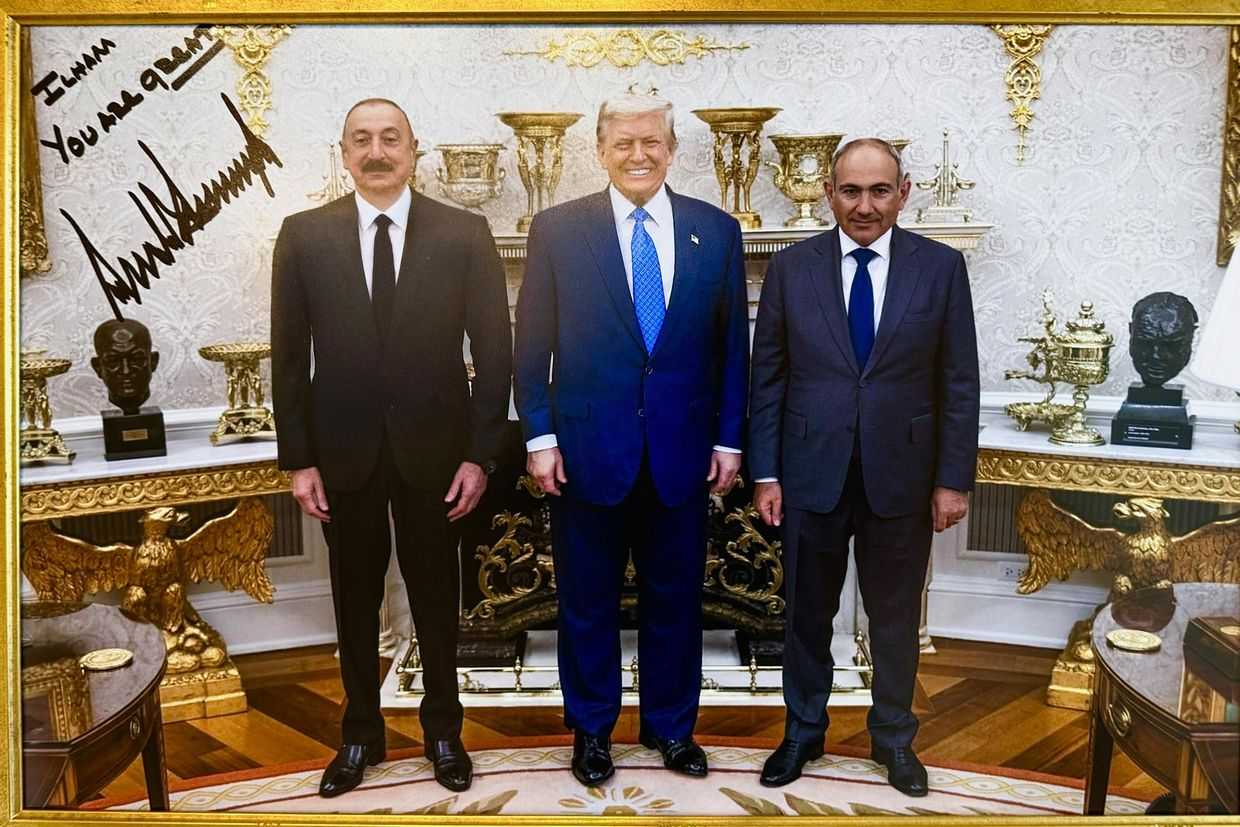 A signed photo gifted by US President Donald Trump (center) of a trilateral meeting with Trump, Azerbaijani President Ilham Aliyev (left), and Armenian Prime Minister Nikol Pashinyan (right). Photo: Ilham Aliyev/X.