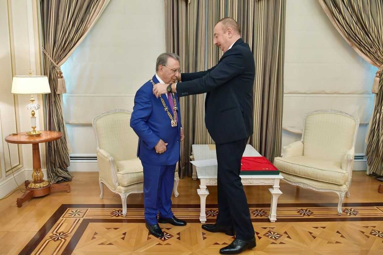 Azerbaijani President Ilham Aliyev awarding former Presidential Administration head Ramiz Mehdiyev with the order of Heydar Aliyev. Official photo.