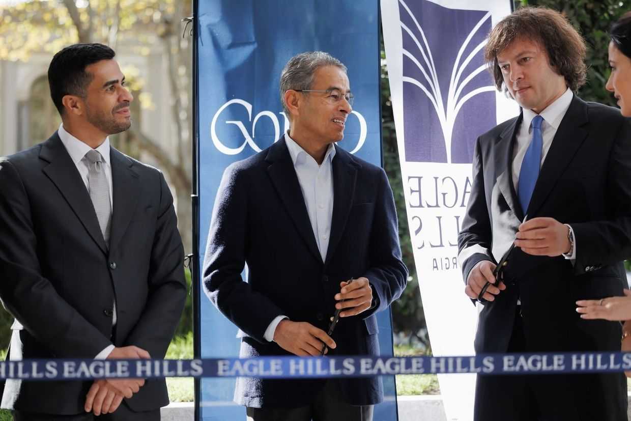 Georgian Prime Minister Irakli Kobakhidze (far right) at the opening ceremony of the Eagle Hills showroom on Rustaveli Avenue. Photo via social media.