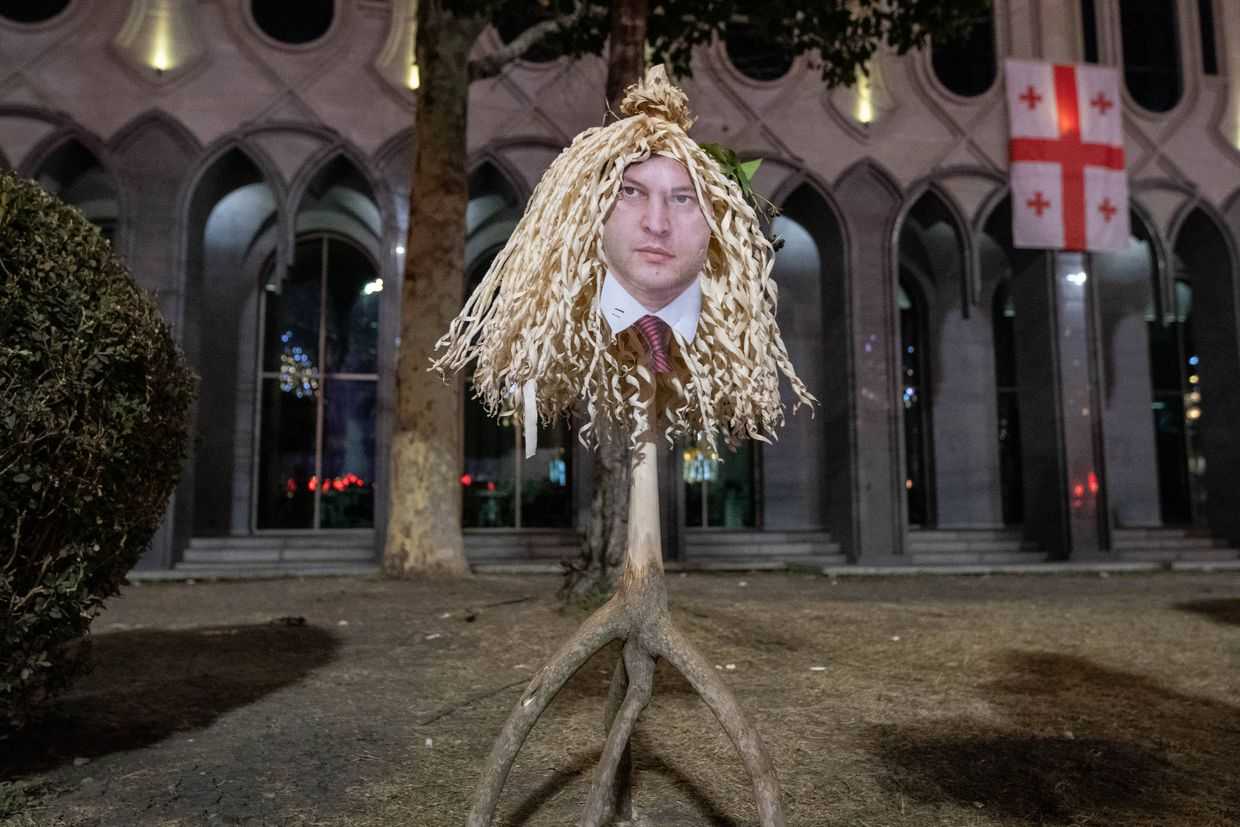 Protesters brought a Chichirakli, a traditional Chichilaki bearing the face of Prime Minister Irakli Kobakhidze to parliament on 1 January. Photo: Mariam Nikuradze/OC Media.&nbsp;