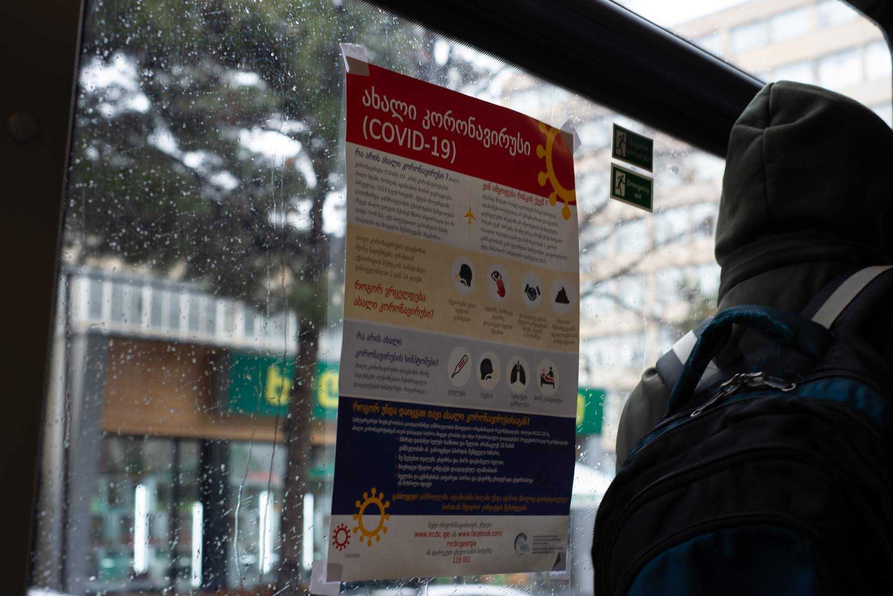 An informational poster about COVID-19 on a bus in Tbilisi. Photo: Tamuna Chkareuli/OC Media.