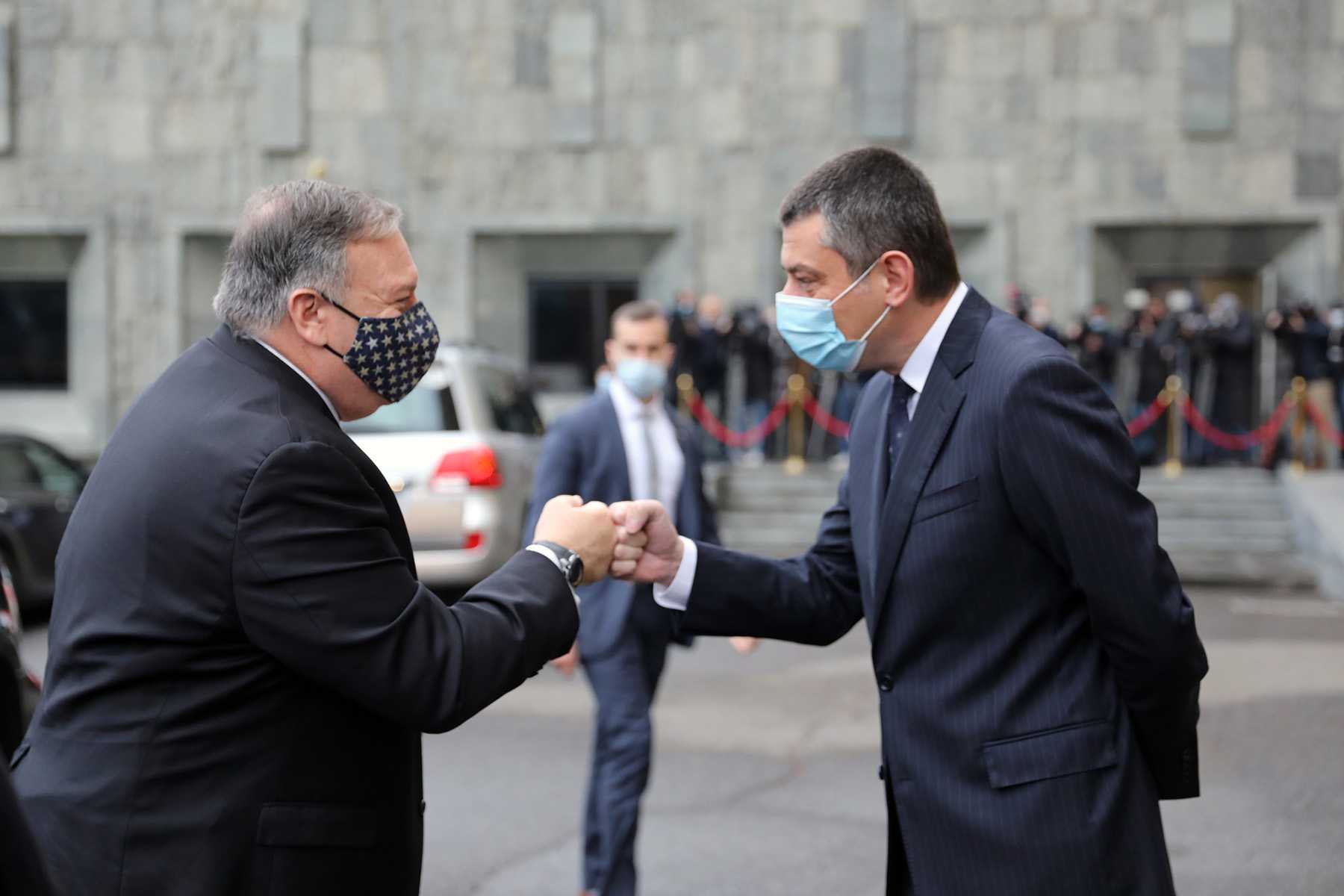 US Secretary of State Mike Pompeo fist bumps with Georgian Prime Minister Giorgi Gakharia. Photo via Giorgi Gakharia.