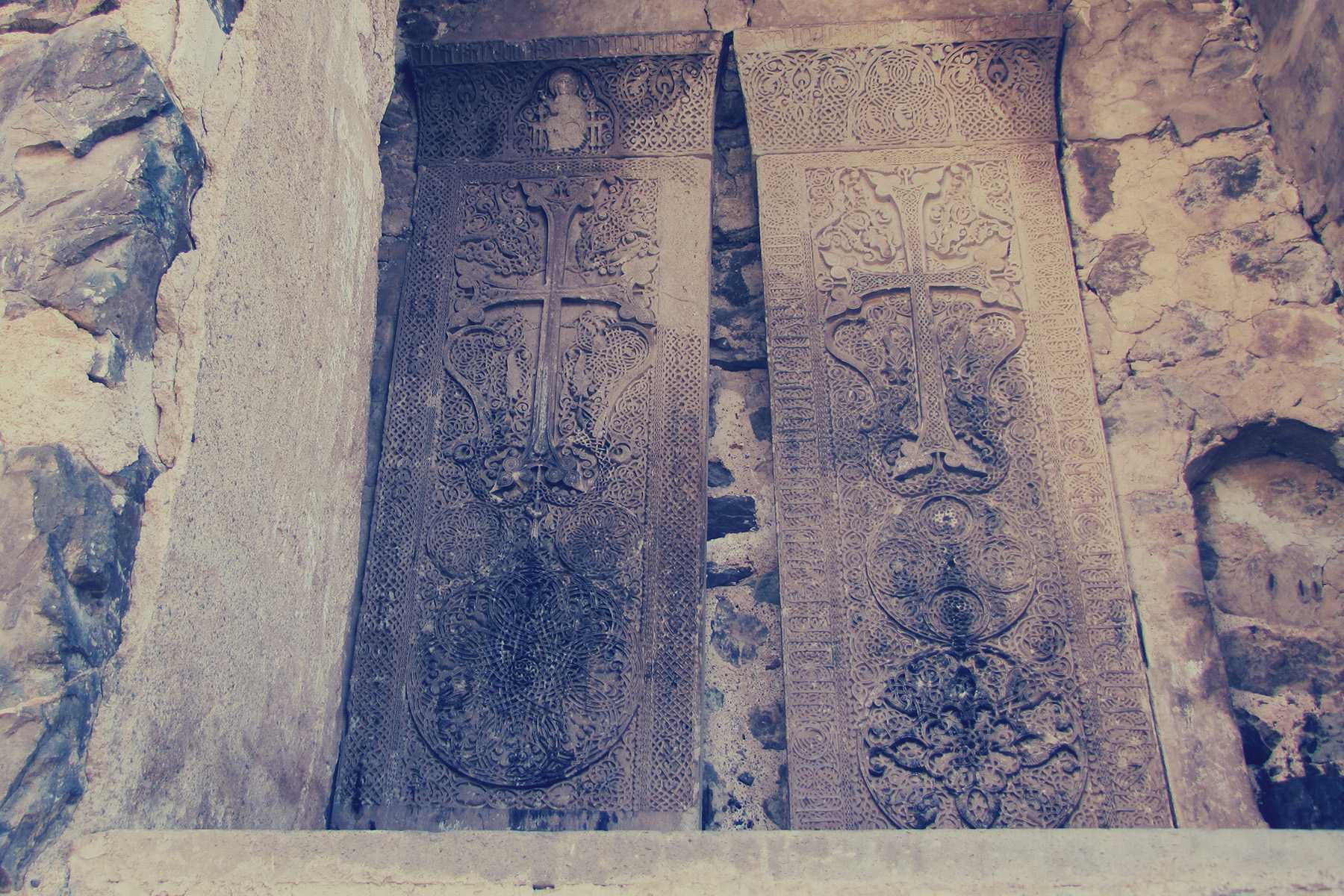 Two Khachkar cross-stones at Dadivank Monastery. Photo via Wikimedia. 