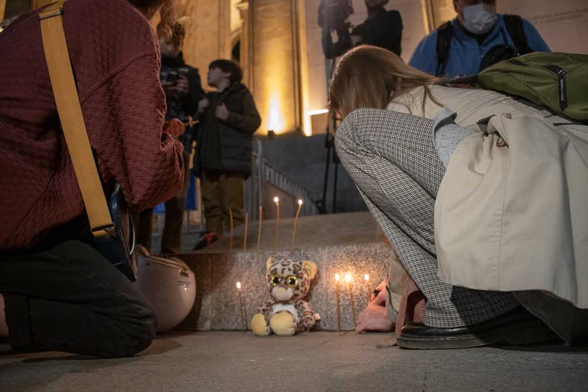 A demonstrator lights a candle for the killed 13-year-old in Vake Park in an anti-Kaladze demonstration on 13 October. OC Media.