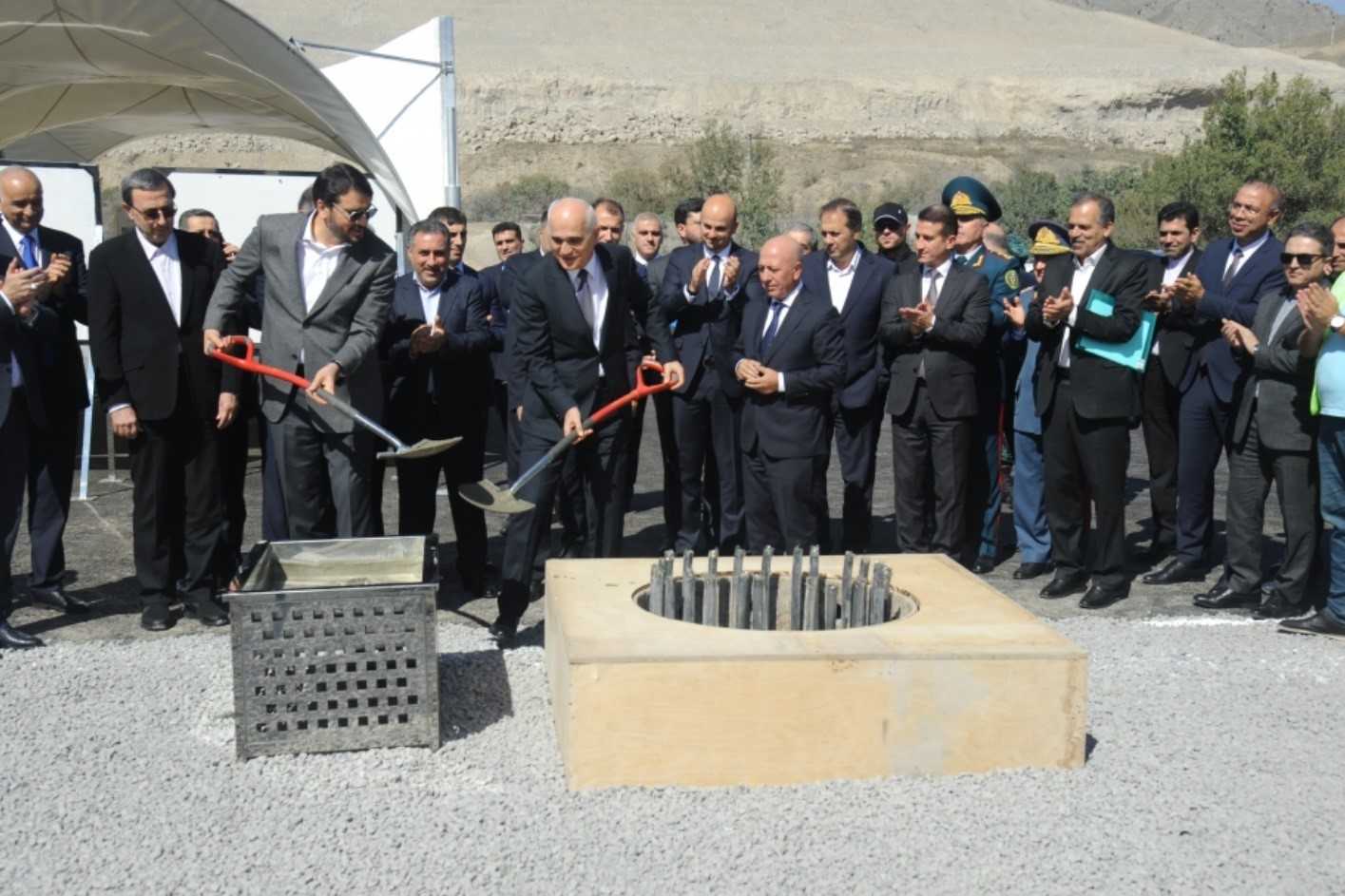 Iran’s Minister of Roads and Urban Development Mehrdad Bazrpash (left) and Azerbaijan’s Deputy Prime Minister Shahin Mustafayev (right) laying the foundation for the transit route. Image via Azertaj.