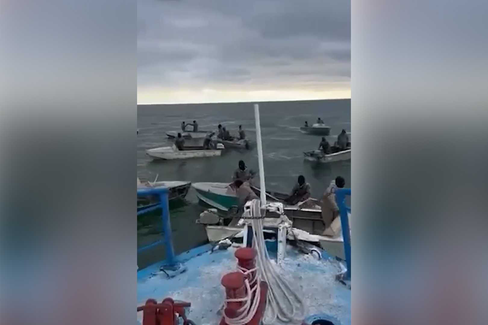 A screengrab from footage showing fishing boats gathering around a patrol boat in Lake Sevan. Screengrab via Youtube.