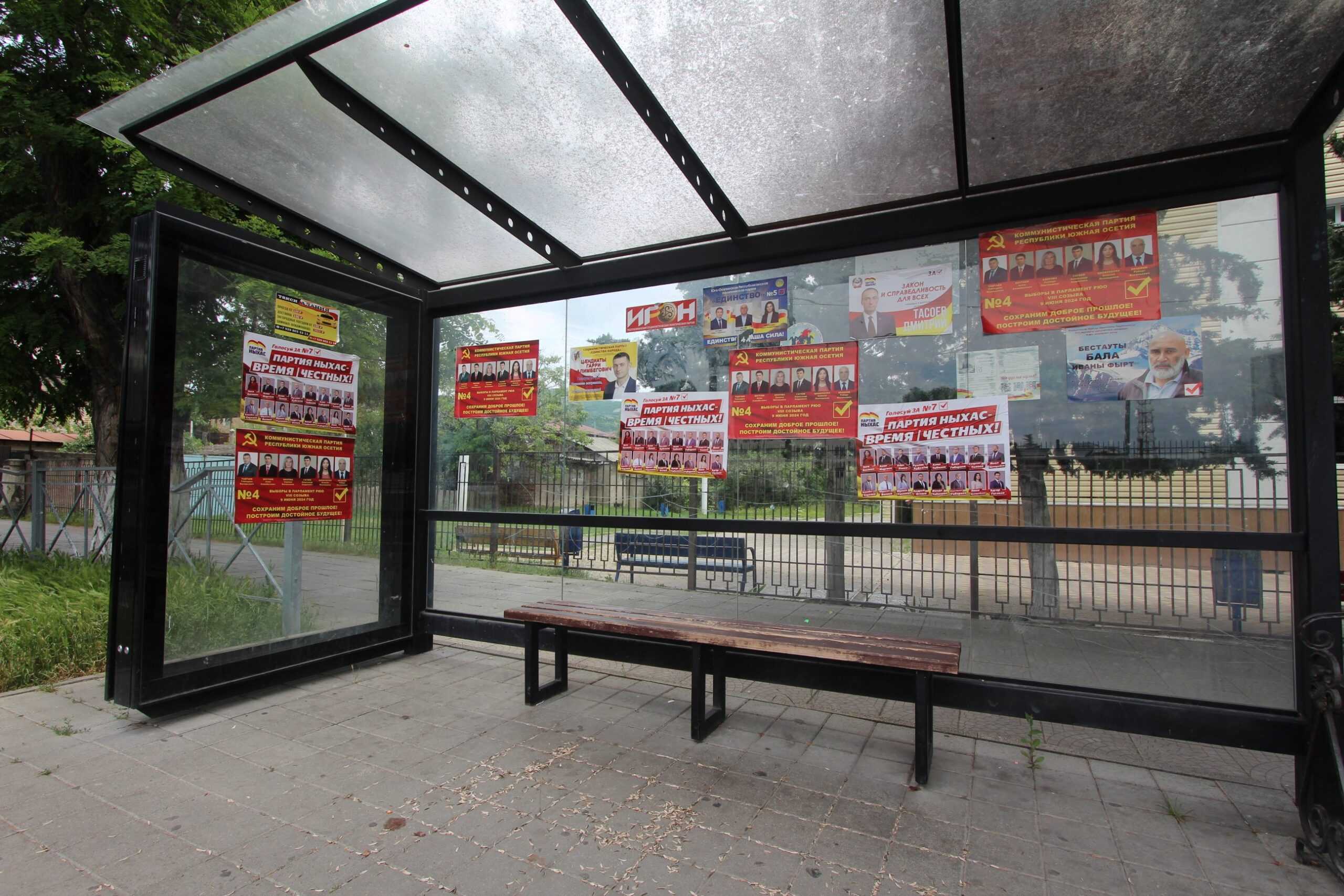 A bus stop covered in campaign posters. Photo: OC Media