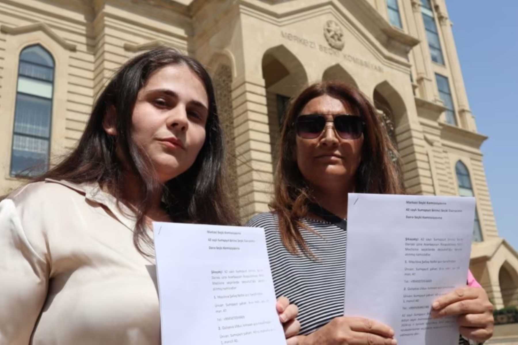 Independent candidates Shafag Mayilova (left) and Ulduz Guliyeva (right) in front of the Central Election Commission. Photo: Ulviyaa Ali.