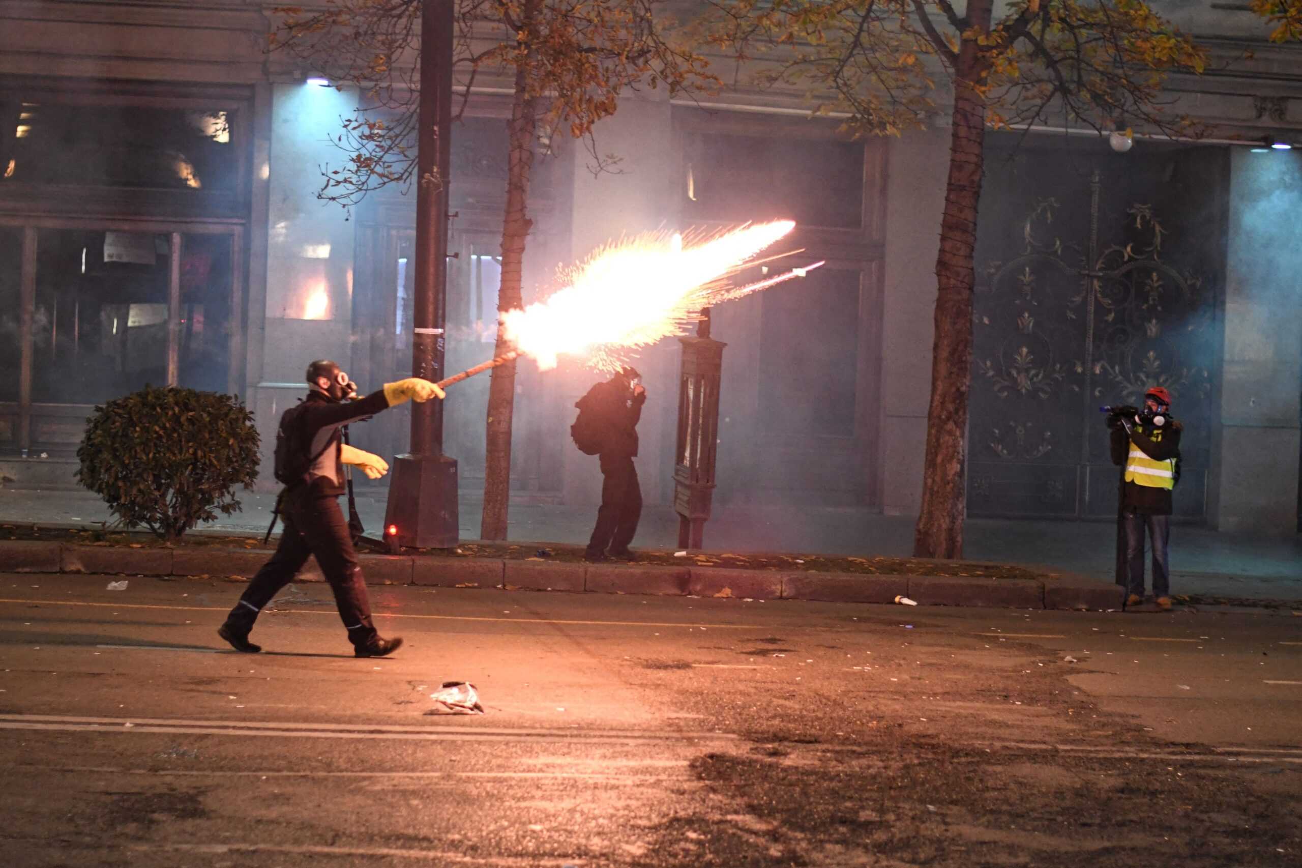 A protester launching fireworks during a protest in Tbilisi. Photo via Mariam Nikuradze/OC Media