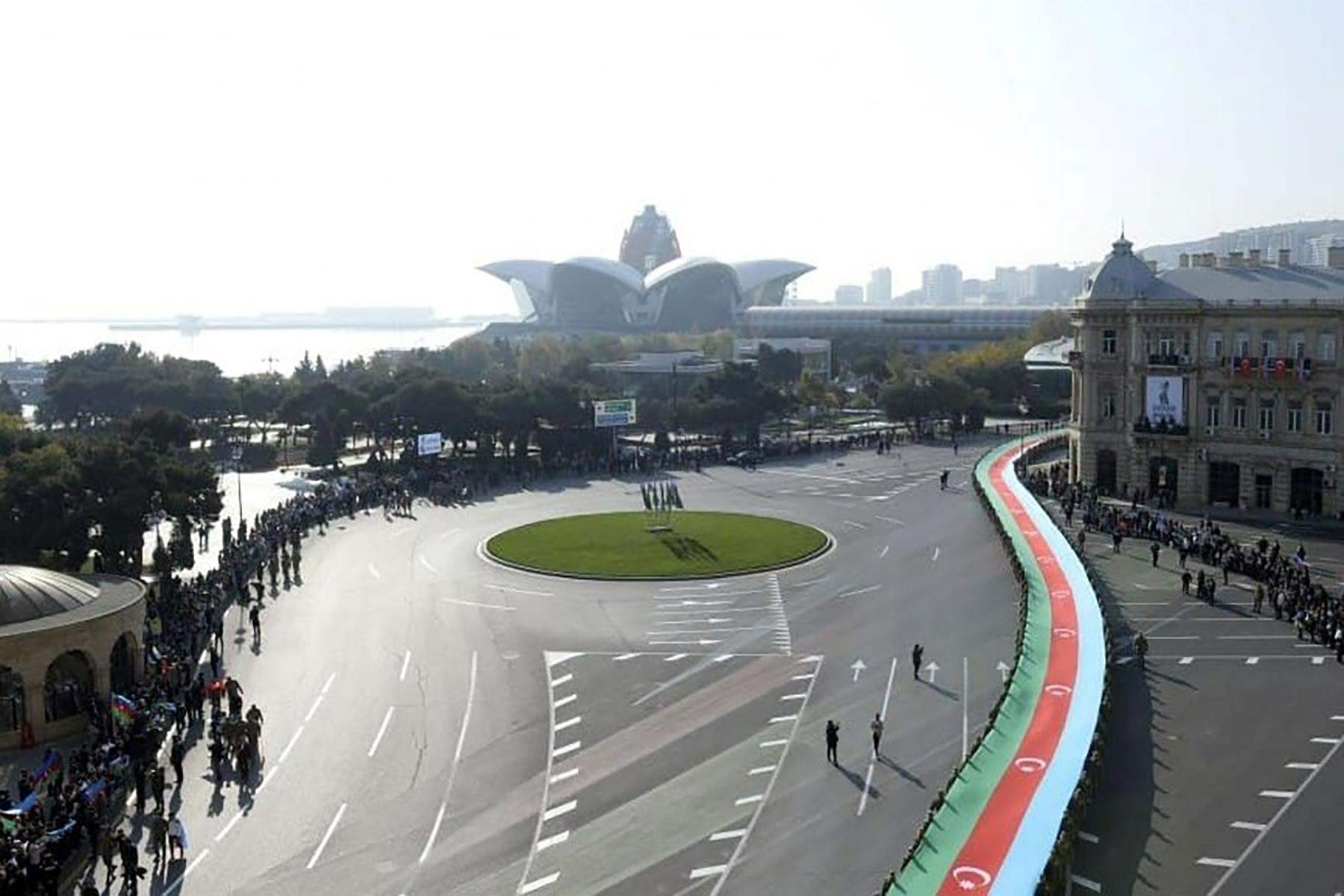 A massive Azerbaijani flag winds its way through Baku on 8 November. Photo: Azertag.