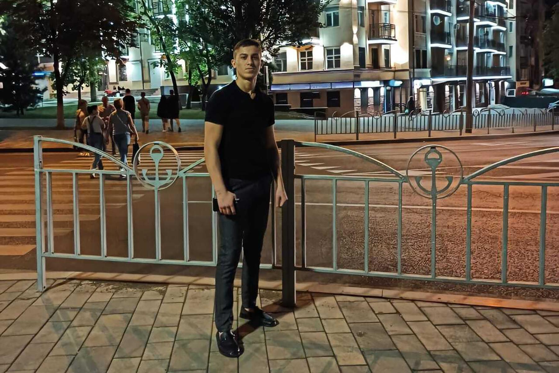 Huseyn Abdullayev in Mariupol. The building behind him has since been destroyed during the Russian siege of the city. Photo: Huseyn Abdullayev.