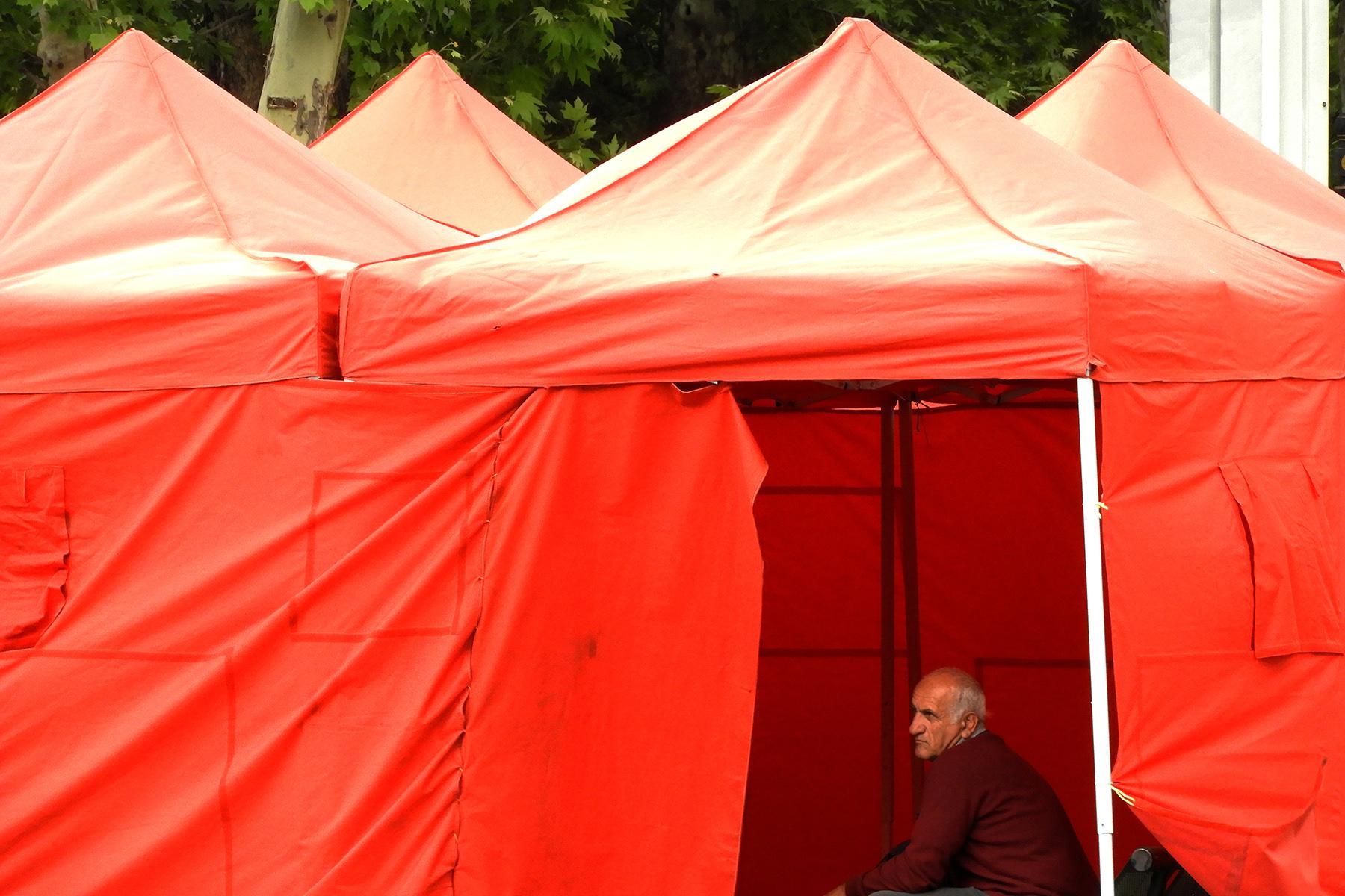 A protestor rests in a tent in Yerevan. Photo: Ani Avetisyan/OC Media.