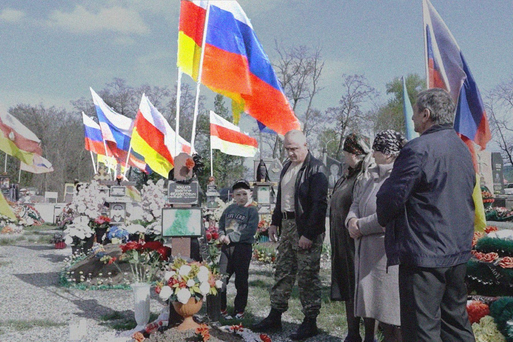 Mourners at the funeral of a soldier in North Ossetia. Image via screengrab from Region15