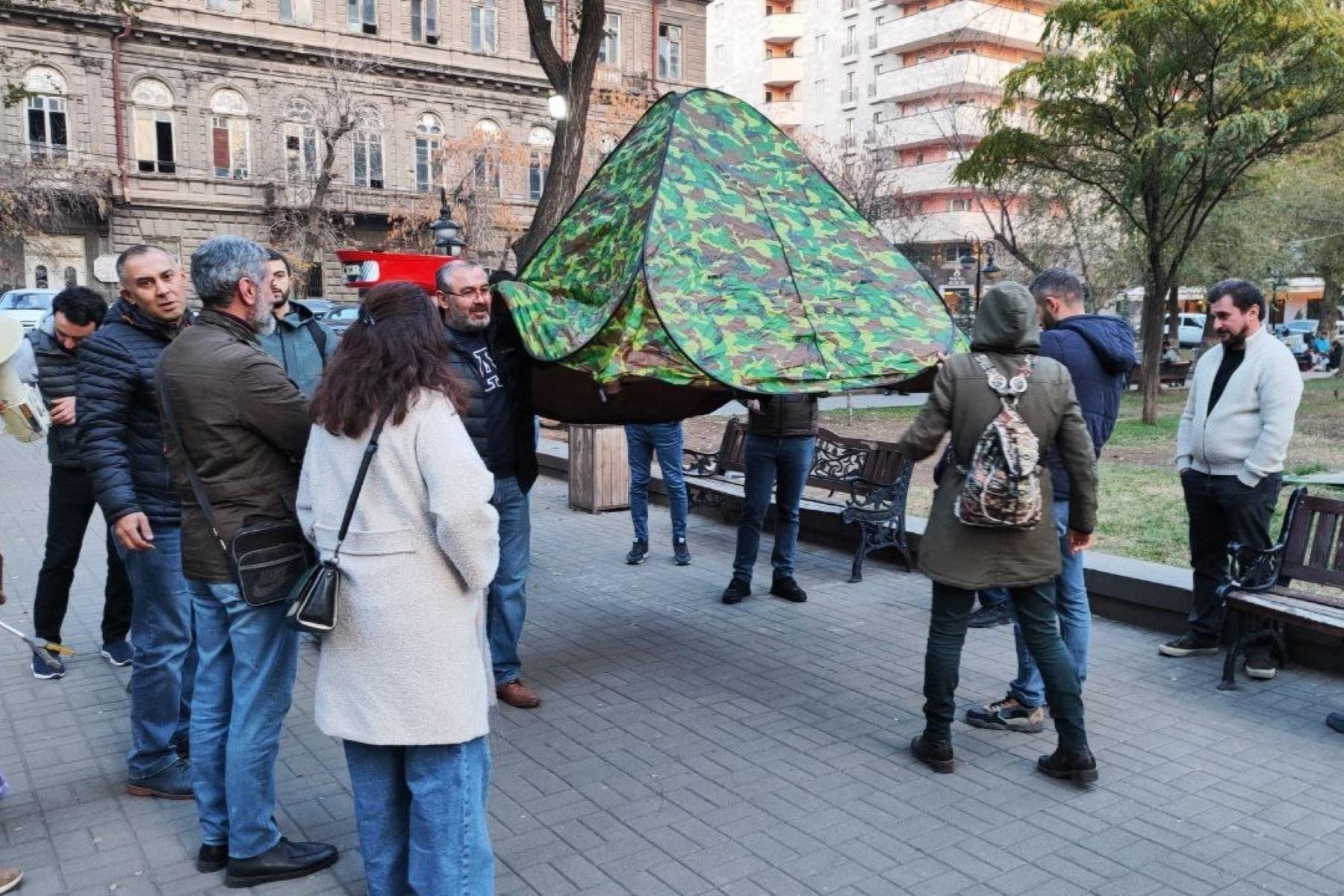 Protesters carrying a tent in Yerevan on 25 November. Photo: Infocom.am