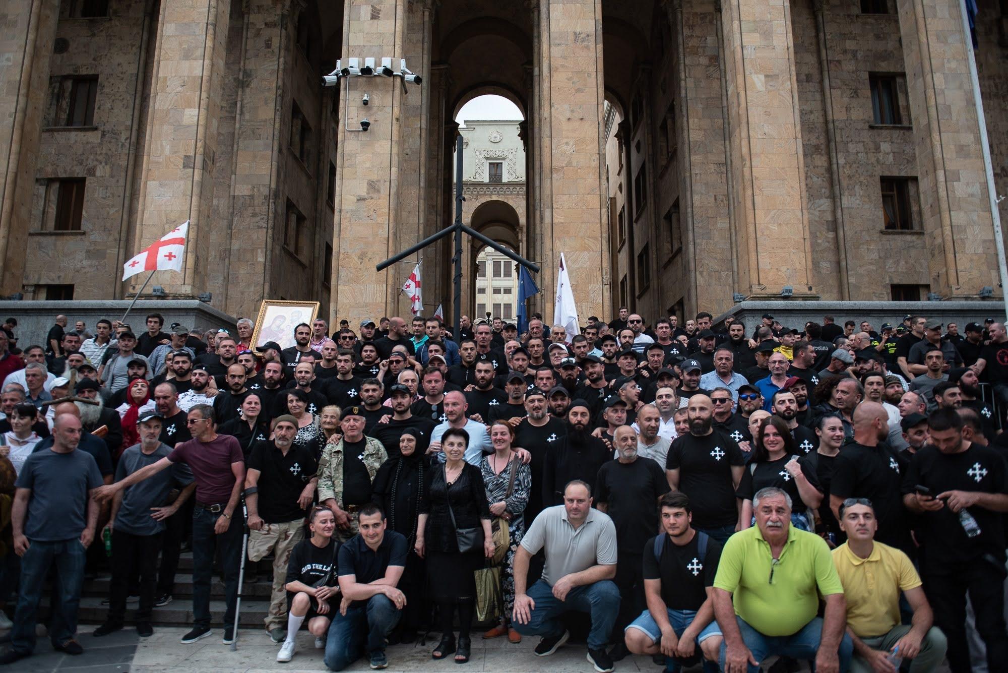 Members of Alt Info pose outside parliament after attacking Pride Fest in July 2023. Photo: Mariam Nikuradze/OC Media.