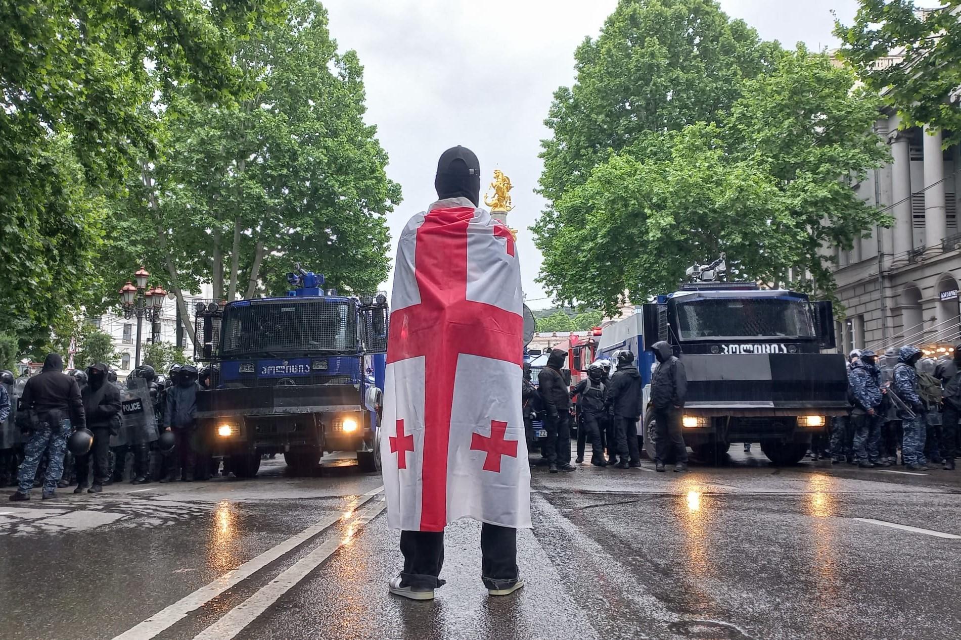 A protester facing riot police on Tuesday. Photo: Anna Edgar/OC Media