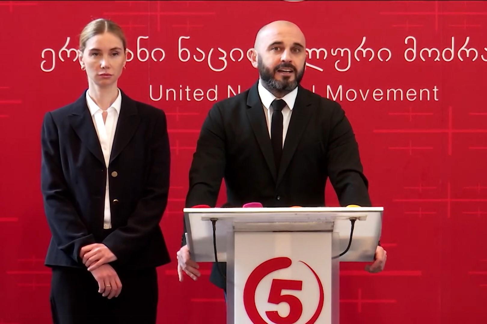 Levan Khabeishvili (right) announcing that he was stepping down as the United National Movement’s chair in favour of Tina Bokuchava (left). Screengrab from the party’s briefing.