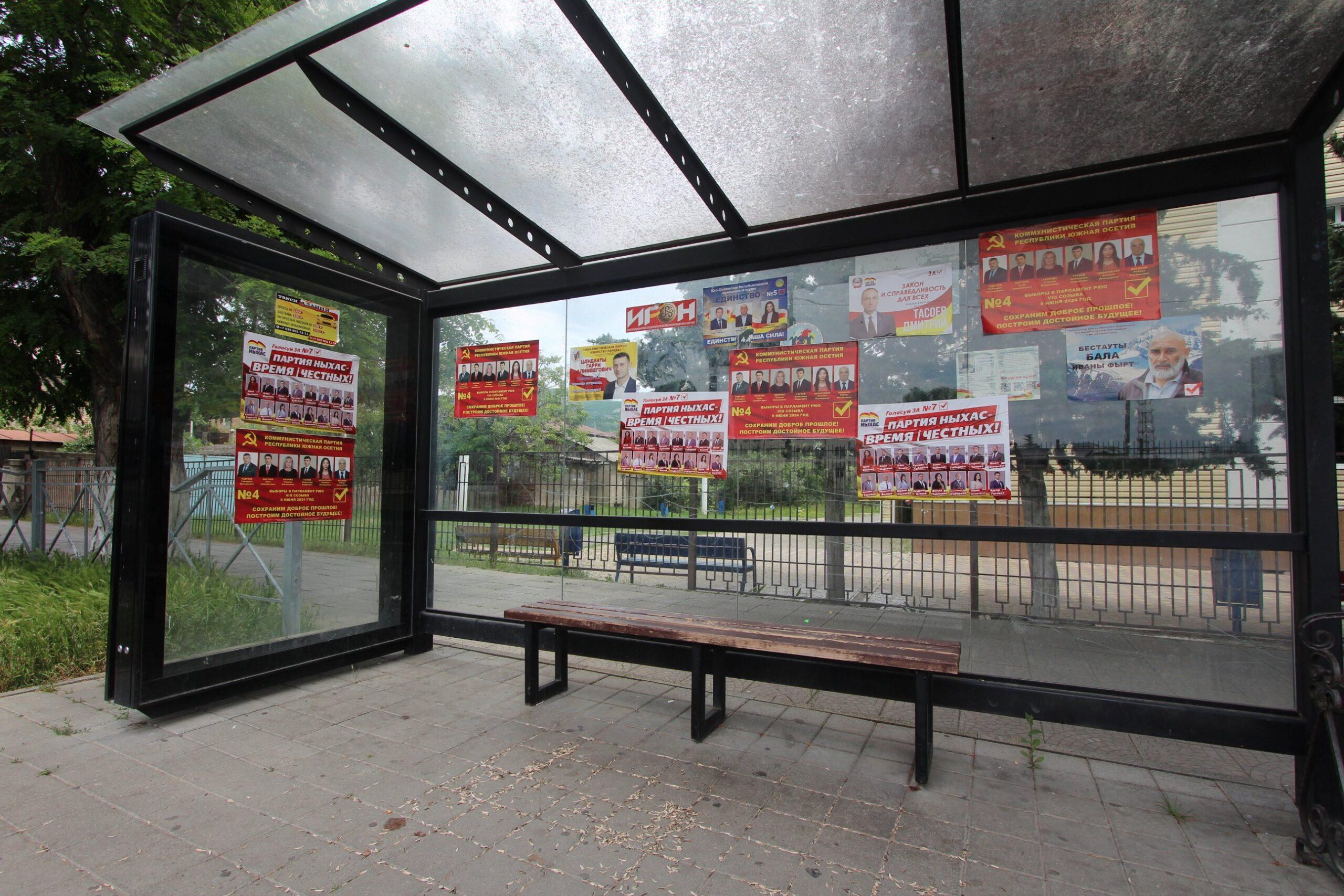 A bus stop covered in campaign posters. Photo: OC Media