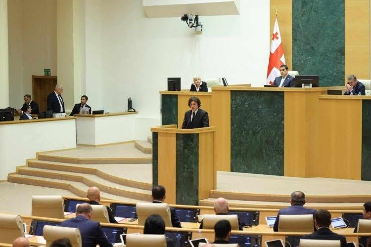 Prime Minister Irakli Kobakhidze addressing the parliament on 28 November. Image via Parliament of Georgia.