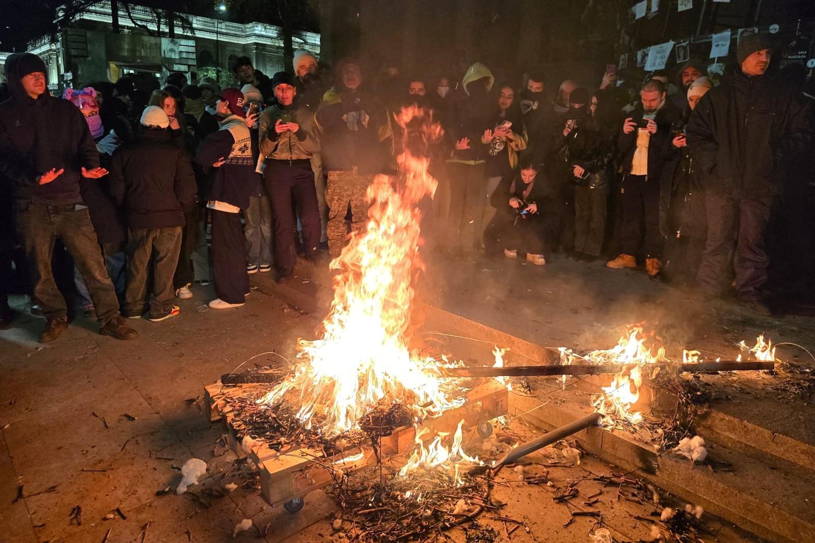 Protesters in Tbilisi burn an effigy of riot police chief Zviad Kharazashvili. Mariam Nikuradze/OC Media.