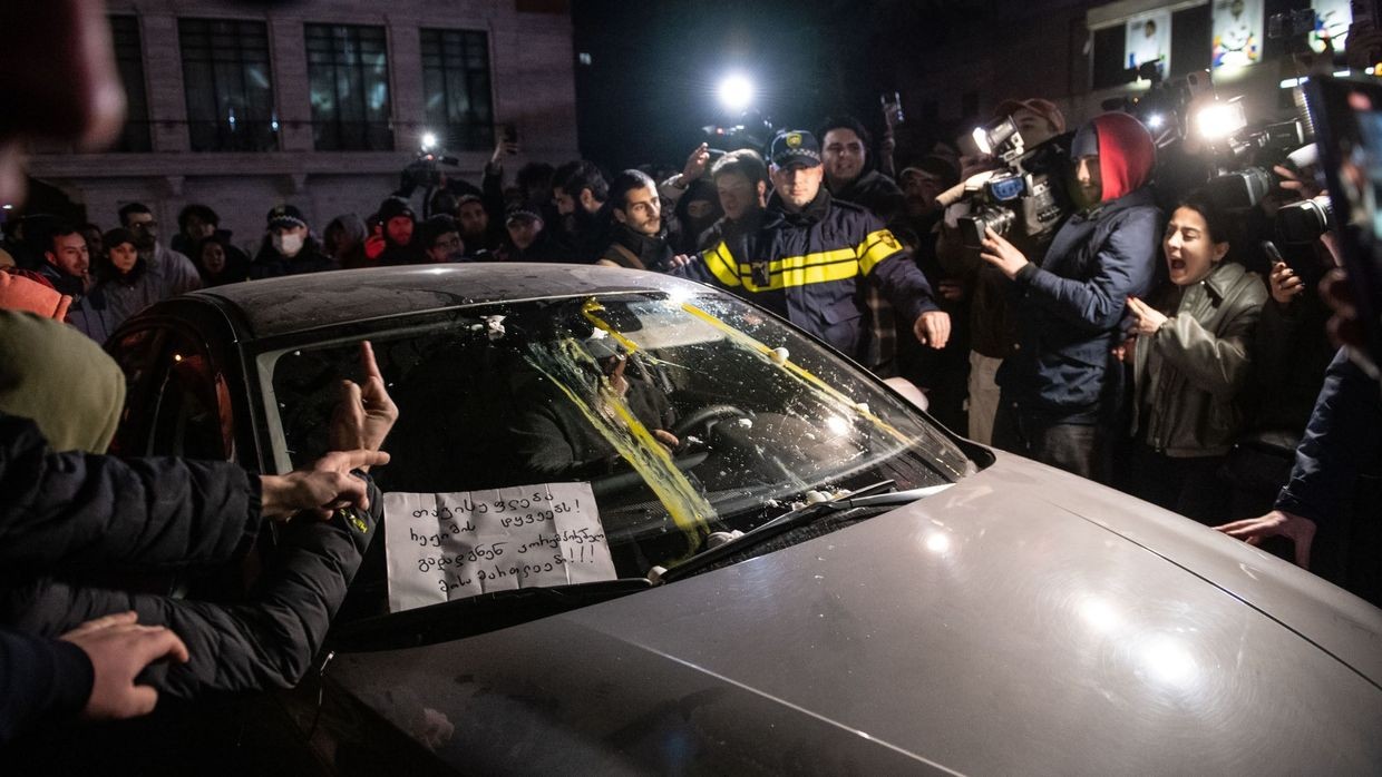The protesters threw eggs at a judge's car and placed a poster on the windshield that read, 'Freedom for the regime's prisoners! Corrupt judges must resign!' Photo: Mariam Nikuradze/OC Media