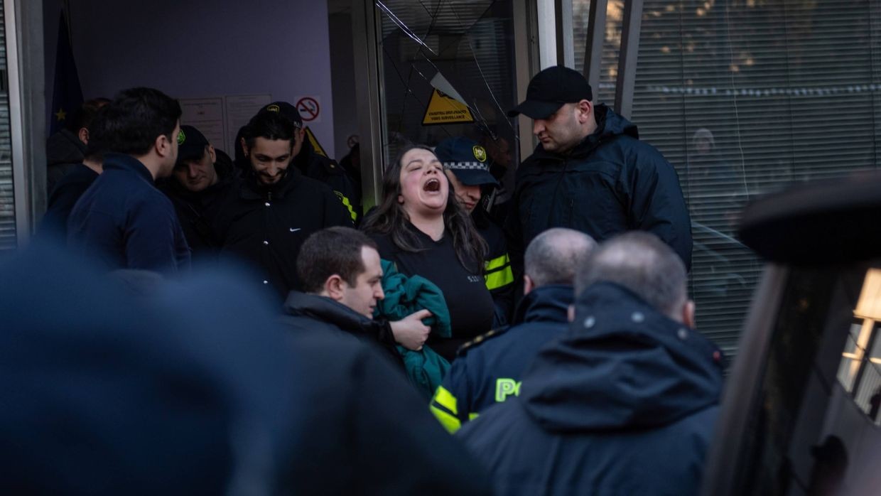 Police detaining a woman during a march ‘against police regime’. Photo: Mariam Nikuradze/OC Media