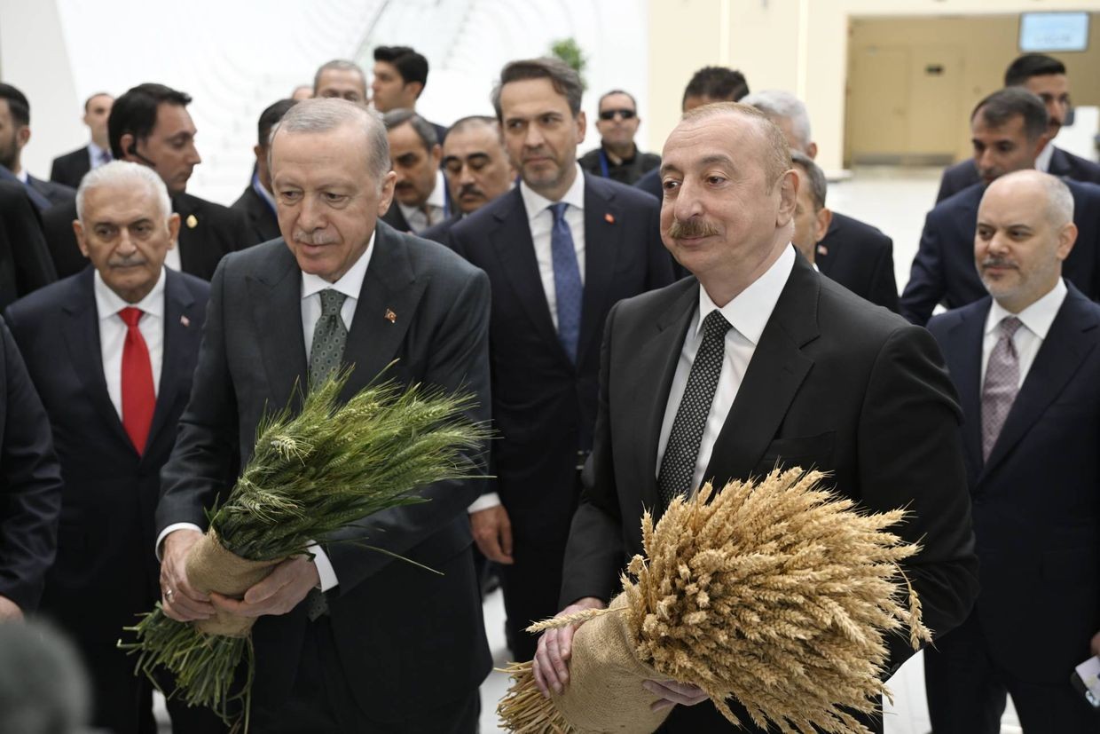 Ilham Aliyev and Recep Tayyip Erdogan in front of a stand where it was noted about Azerbaijani and Turkish companies operating in Nagorno-Karabakh and the surrounding areas. Photo: President.az official website.
