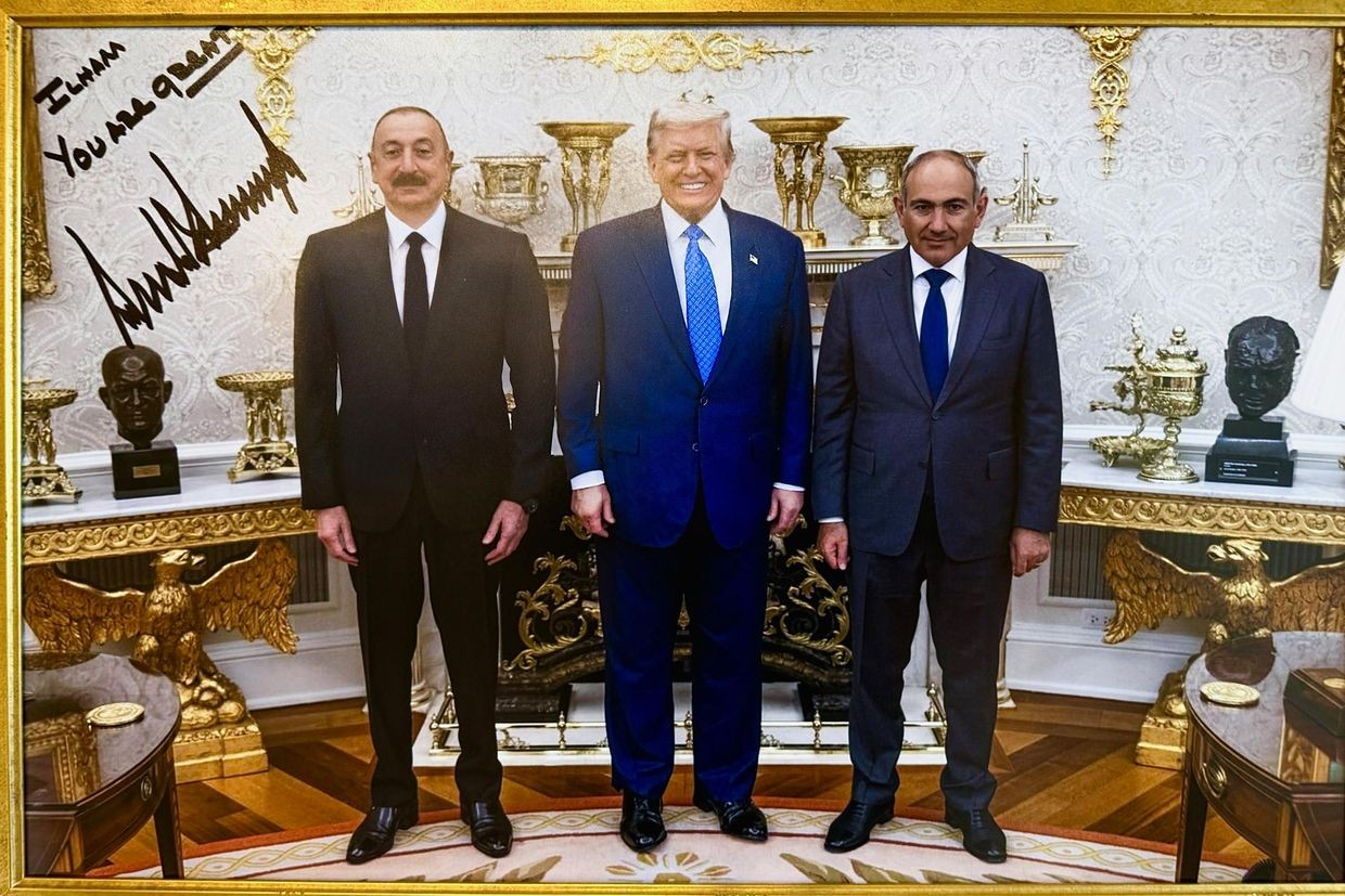 A signed photo gifted by US President Donald Trump (center) of a trilateral meeting with Trump, Azerbaijani President Ilham Aliyev (left), and Armenian Prime Minister Nikol Pashinyan (right). Photo: Ilham Aliyev/X.