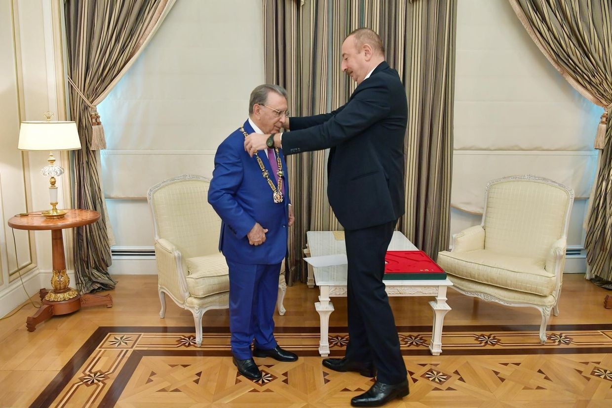 Azerbaijani President Ilham Aliyev awarding former Presidential Administration head Ramiz Mehdiyev with the order of Heydar Aliyev. Official photo.