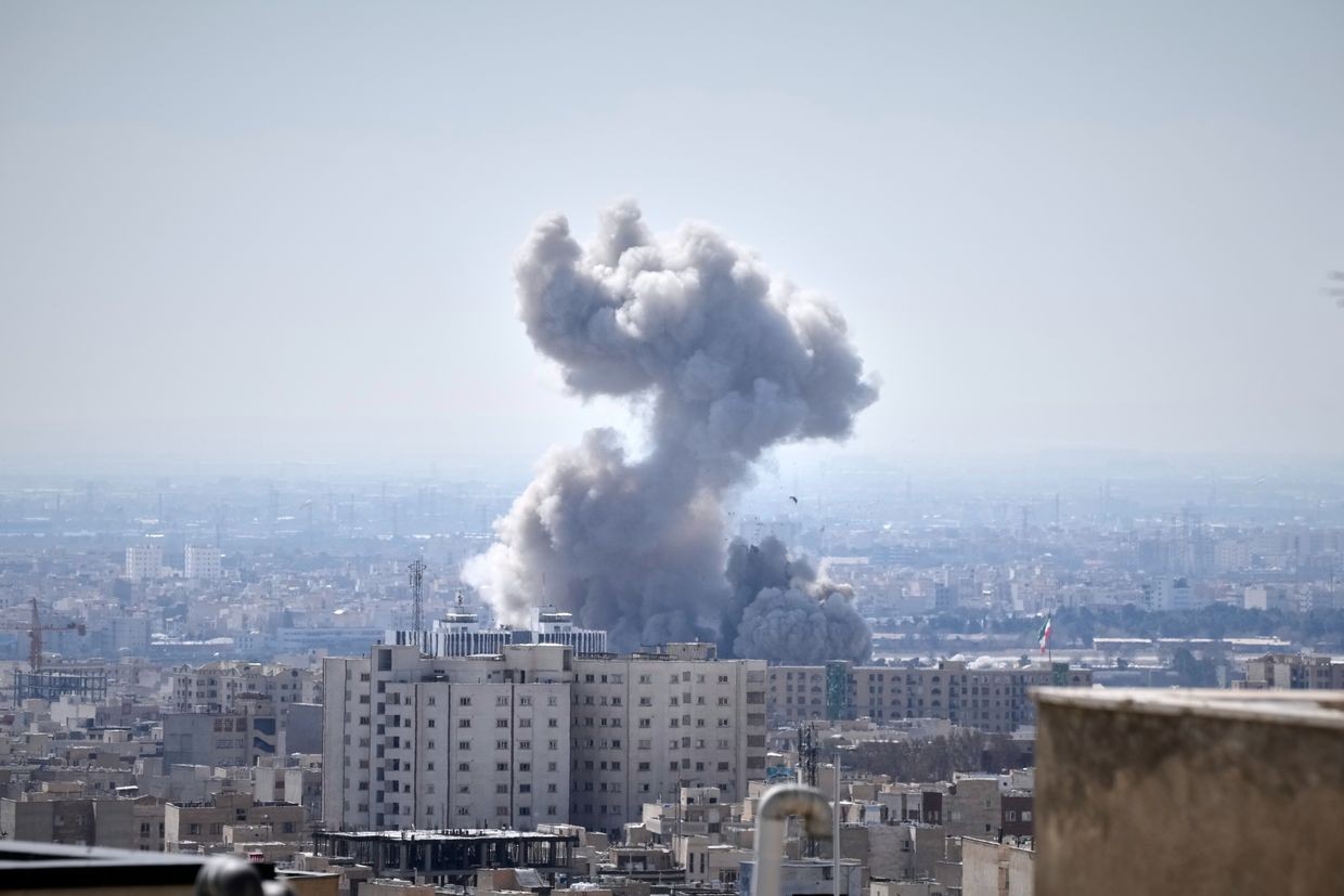 A plume of smoke rises after a strike in Tehran, Iran, Sunday, 1 March 2026. (AP Photo/Vahid Salemi).