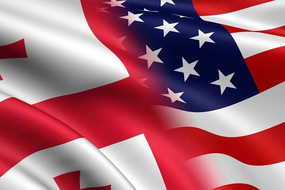 The flags of Georgia and the US. Official photo.