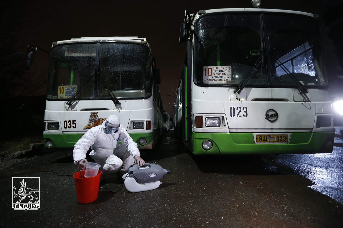 A worker disinfects a bus in Yerevan. Official photo.