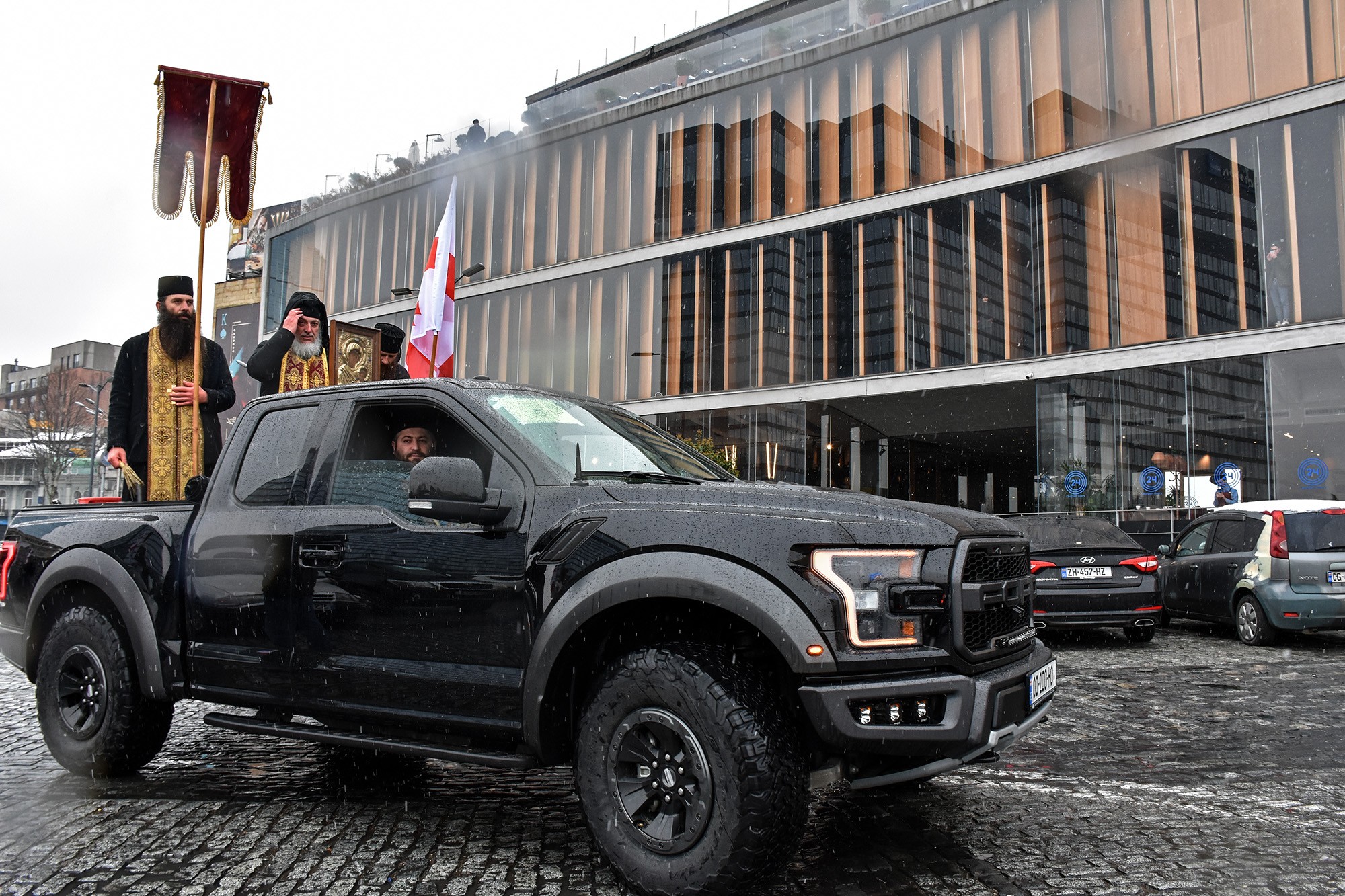 On 17 March, priests in mobile ‘blessmobiles’ drove through Tbilisi’s streets spraying holy water to combat the novel coronavirus. Photo: Mariam Nikuradze/OC Media