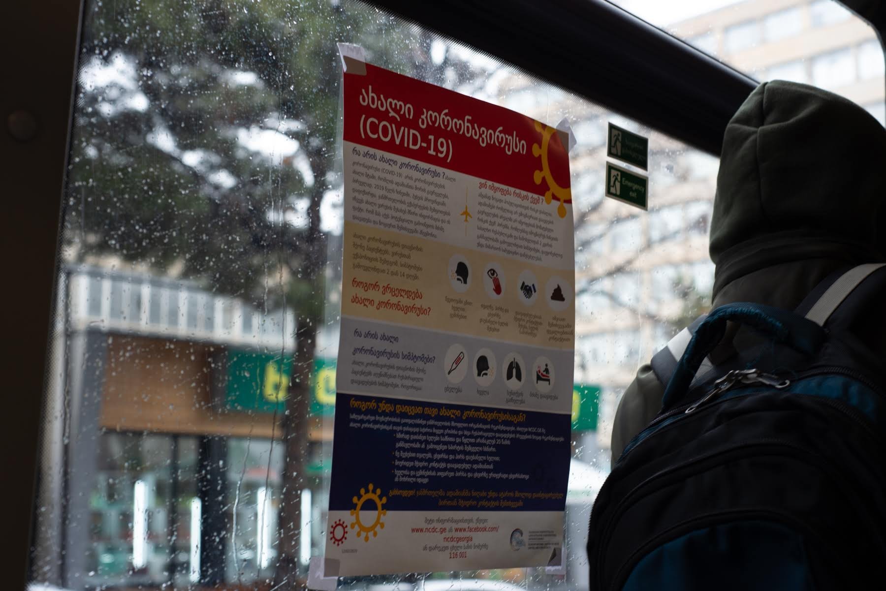 An informational poster about COVID-19 on a bus in Tbilisi. Photo: Tamuna Chkareuli/OC Media.