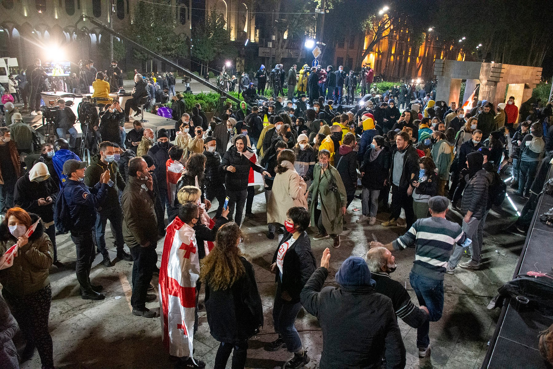 Protesters dancing outside parliament after the curfew began. Photo: Mariam Nikuradze/OC Media.