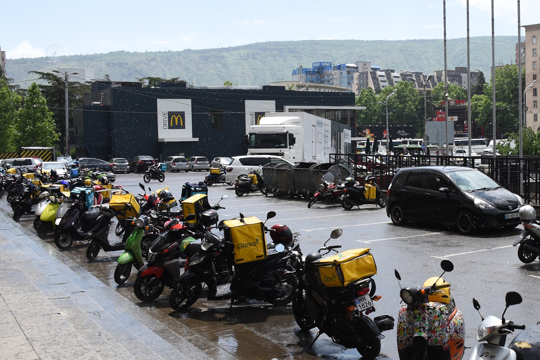 Scooters belonging to Glovo couriers parked at the protest site in Tbilisi. Photo: Tata Shoshiashvili/OC Media.