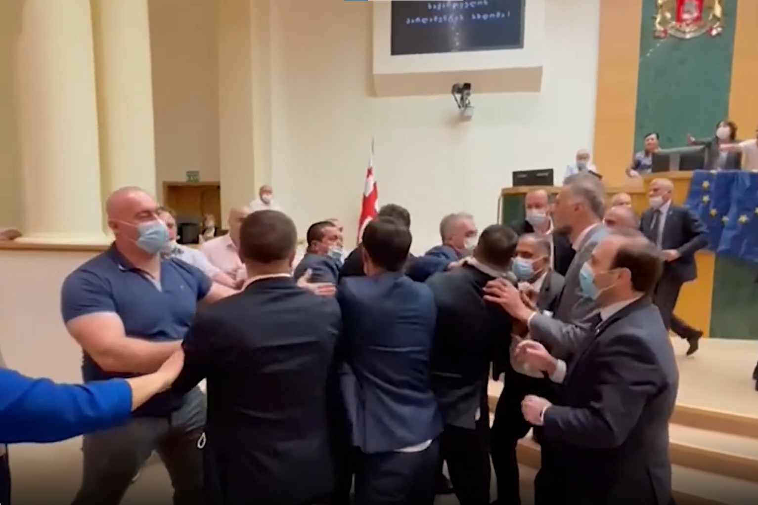 Government and opposition MPs brawl in the Georgian Parliament on 12 July. Image via Maestro TV.
