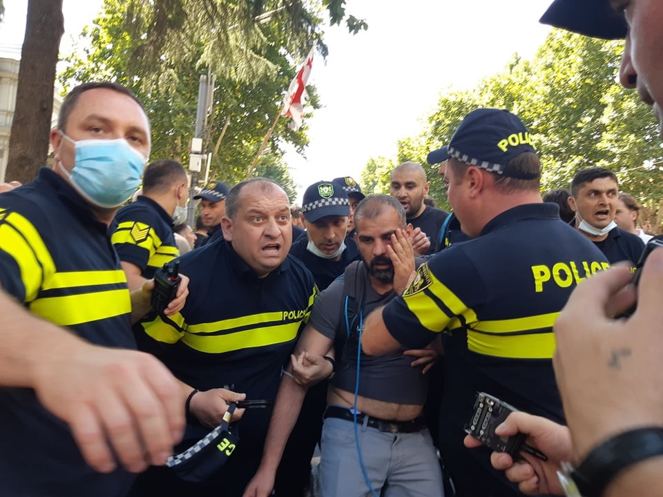First Channel Camera operator Ilia Tvalishvili being carried away by police on Rustaveli Avenue. Photo: Publika.