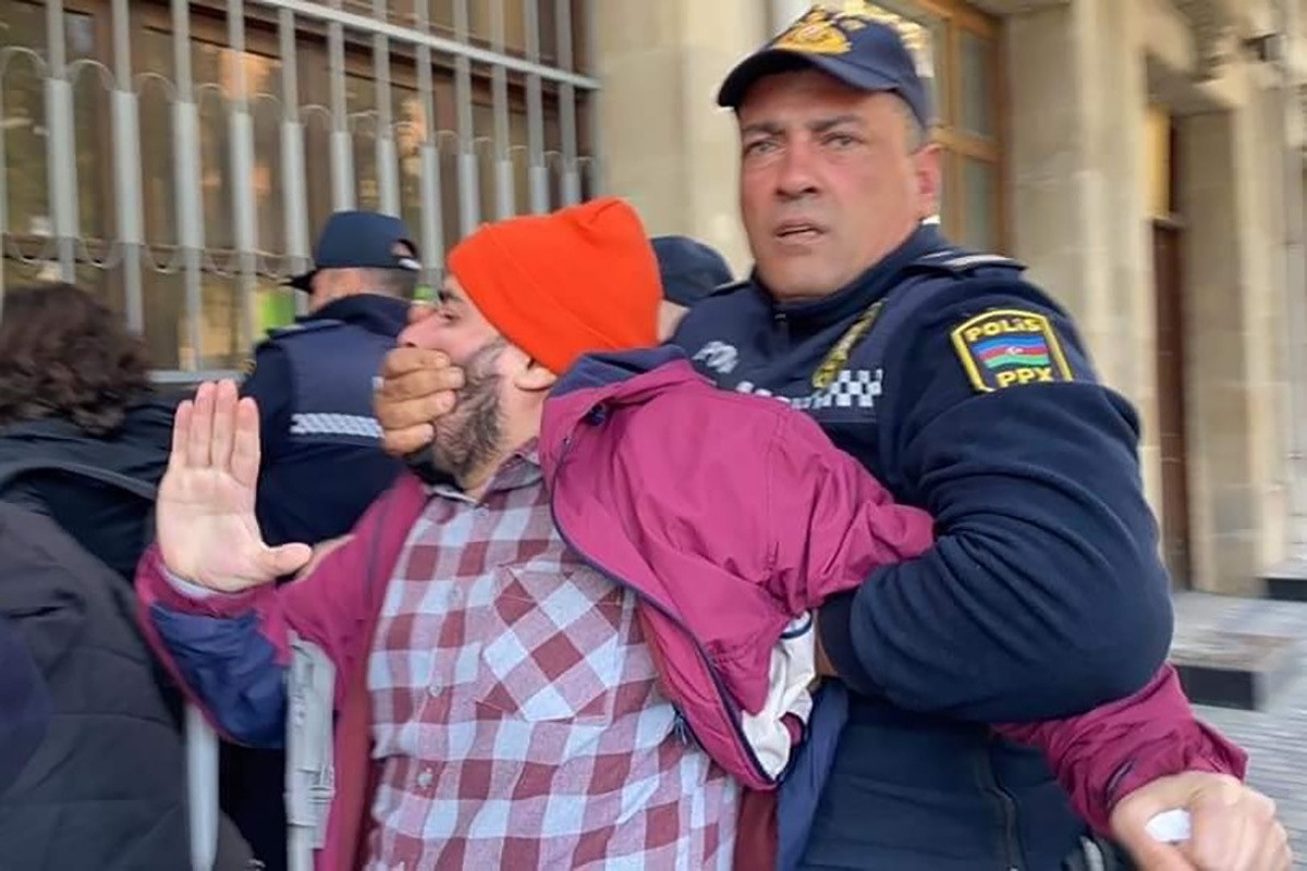 Elmir Abbasov being dragged away by police. Photo: Parvana Gurbanli.