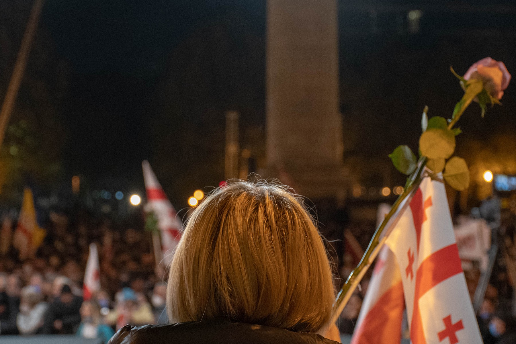 A woman holds a rose, a symbol of the 2003 Rose Revolution, at a protest in support of Mikheil Saakashvili in Tbilisi on 9 November. Photo: Shota Kincha/OC Media.