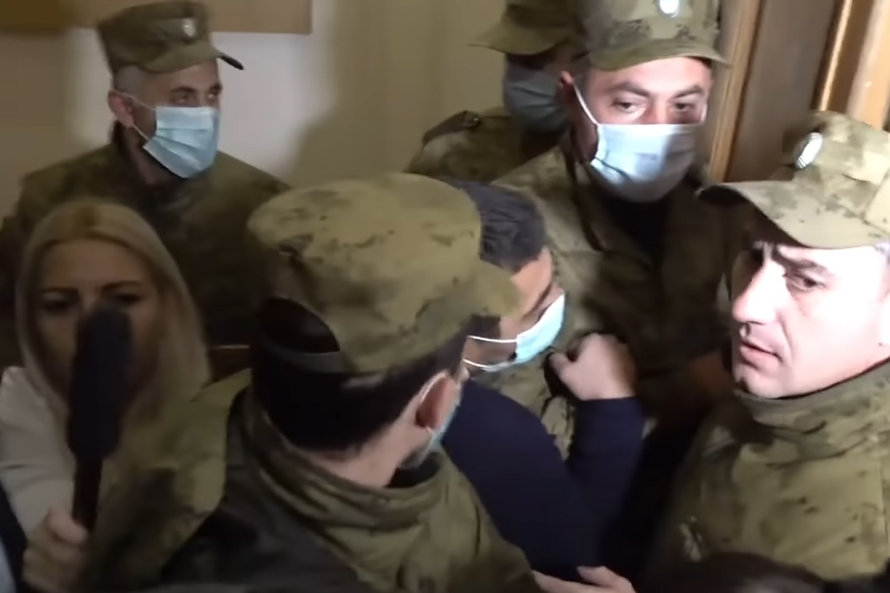 Reporters attempt to take interviews in the immediate aftermath of the incident. Still from video via News.am