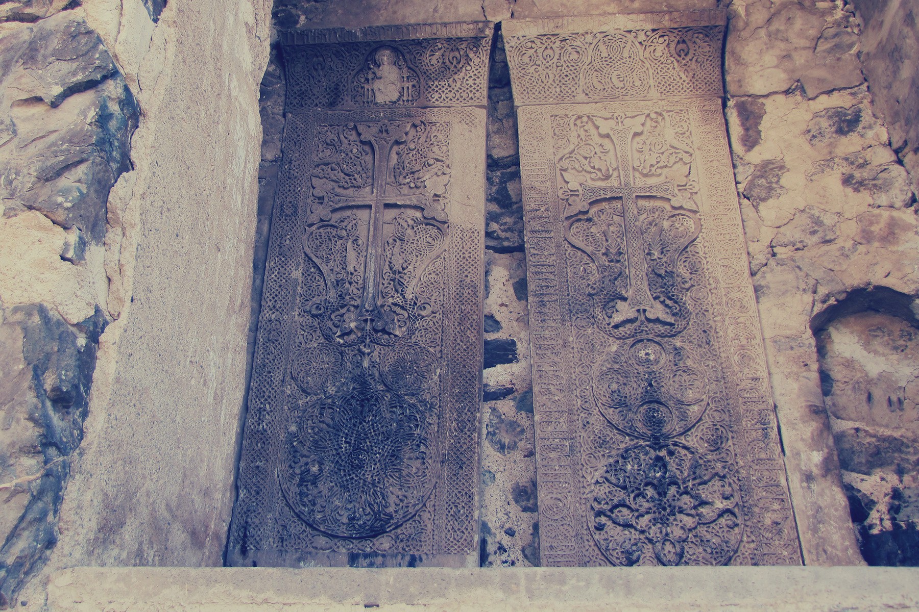 Two Khachkar cross-stones at Dadivank Monastery. Photo via Wikimedia. 