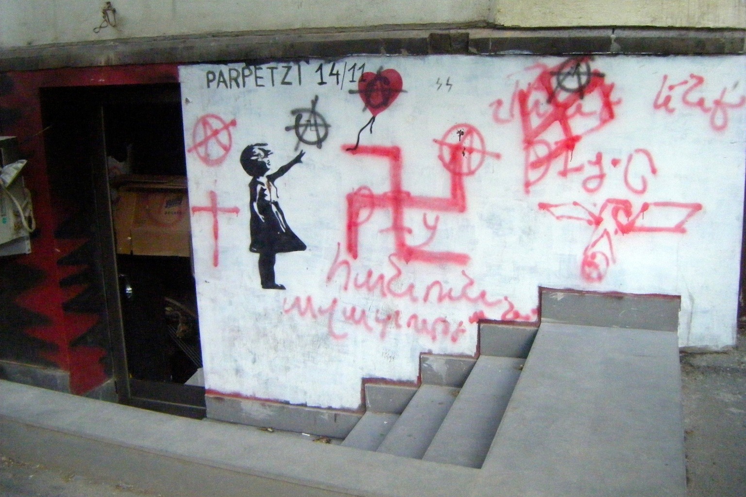 The entrance to the former DIY bar in Yerevan was defaced with Nazi graffiti after it was set on fire. Photo: NG, via ianyanmag.