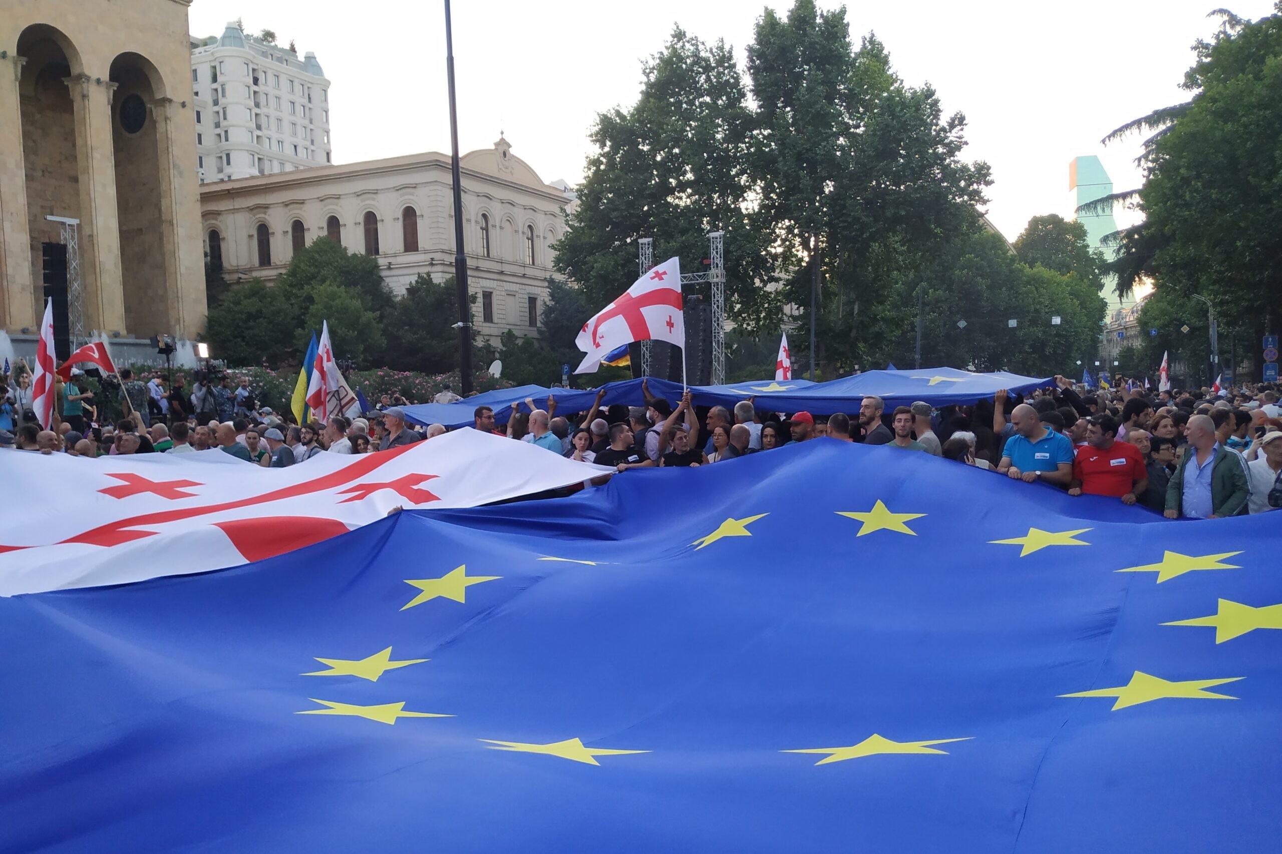 A giant EU flag alongside the Georgian flag at the demonstration outside parliament on 3 July 2022. Photo: Shota Kincha/OC Media.