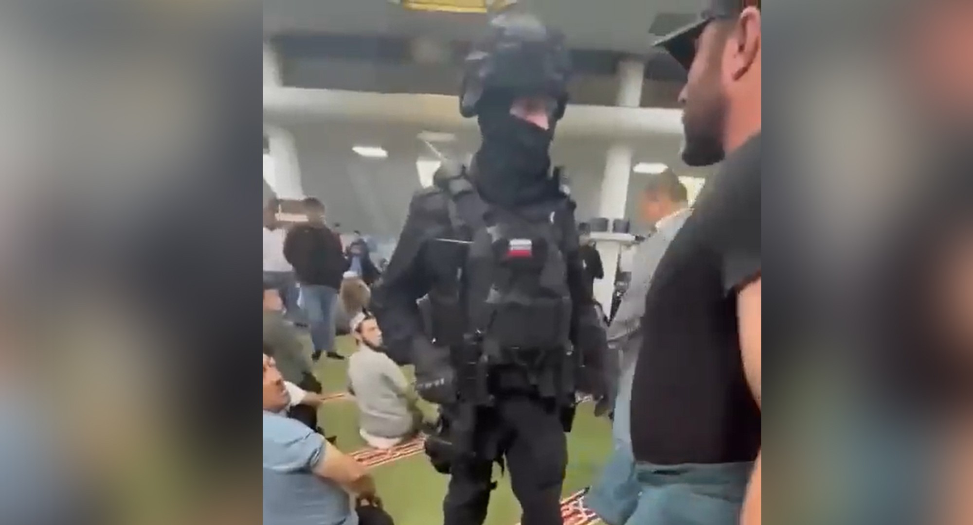 A police officer in the Islamic Centre in Kotelniki, Moscow. Screengrab via social media.