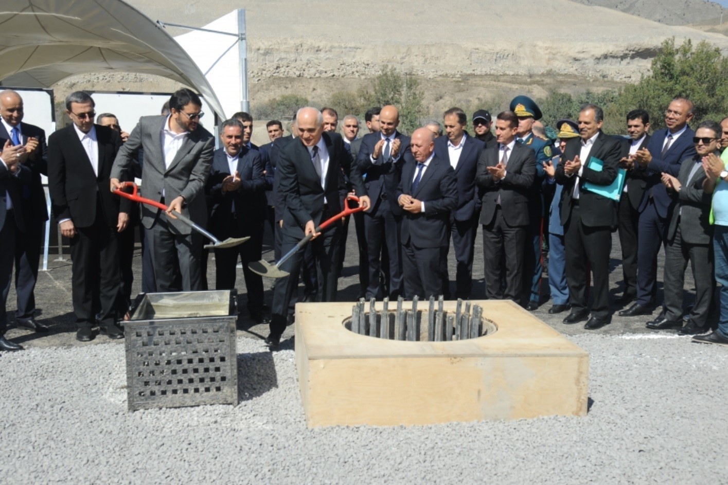Iran’s Minister of Roads and Urban Development Mehrdad Bazrpash (left) and Azerbaijan’s Deputy Prime Minister Shahin Mustafayev (right) laying the foundation for the transit route. Image via Azertaj.