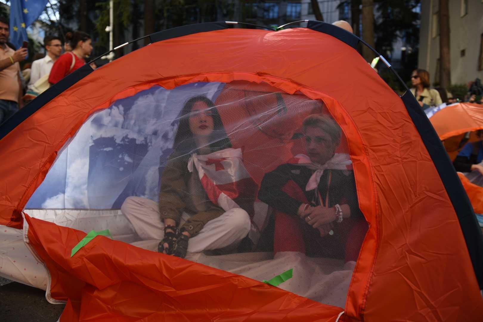 Protesters in a tent outside parliament. 5 October 2023. Image: Mariam Nikuradze/OC Media