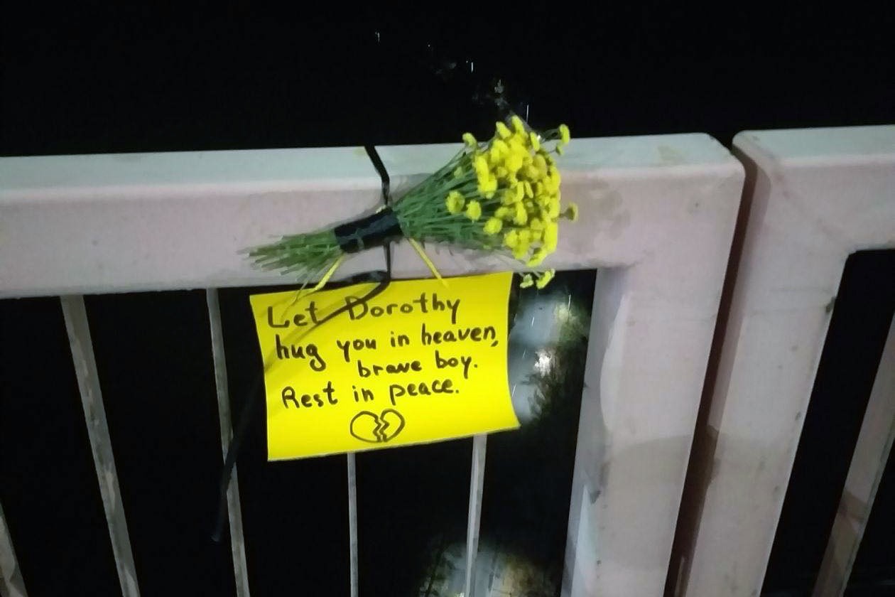A tribute to the victim left at the site of his death.