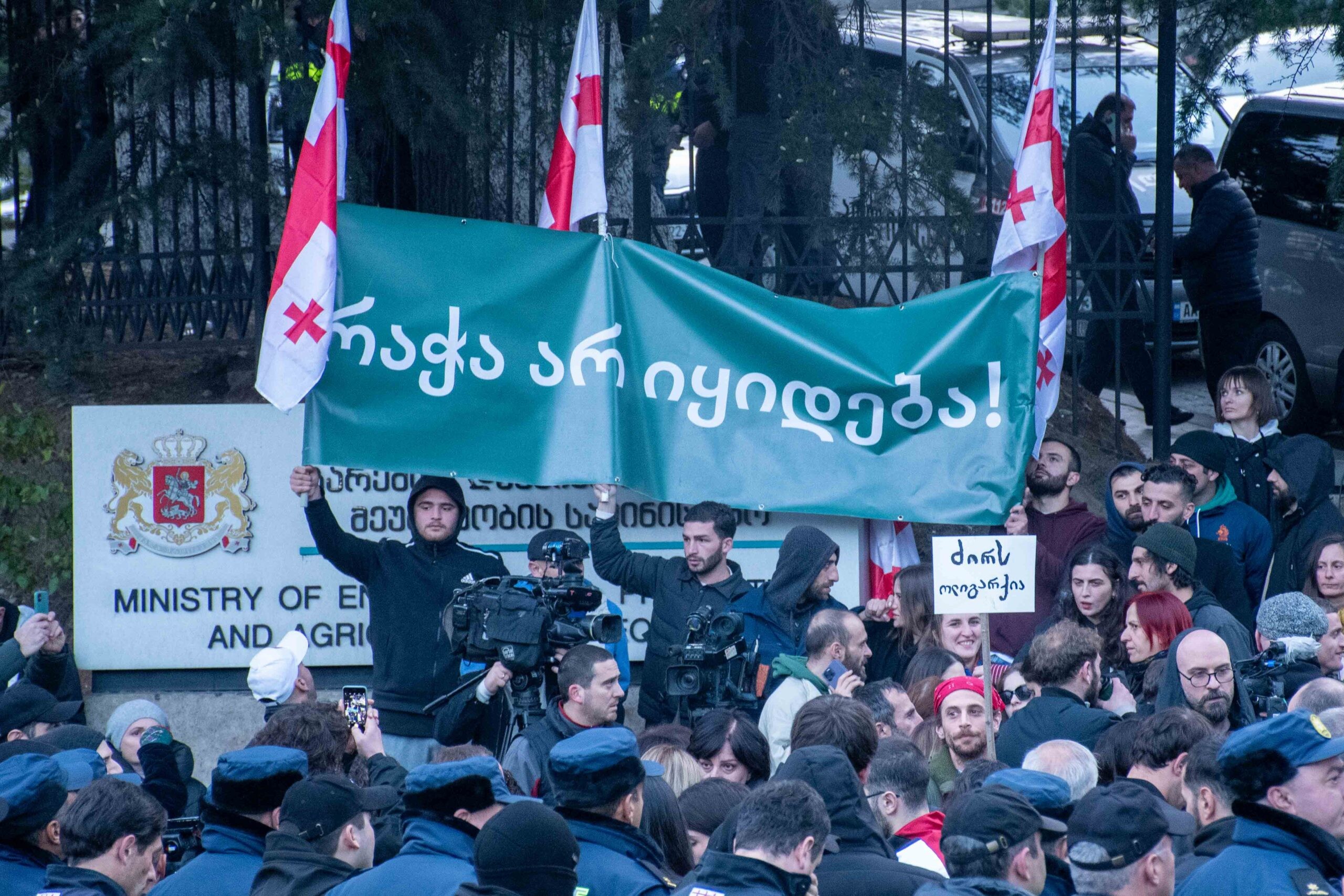 Members Saving Rioni Valley movement holding up a banner that reads 'Racha is not for sale' in against the sale of Racha forests to a private company. Shota Kincha/OC Media.